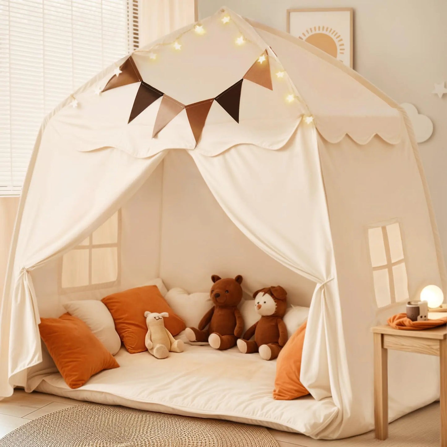 Children's play tent with plush toys and decorative lights in a room.